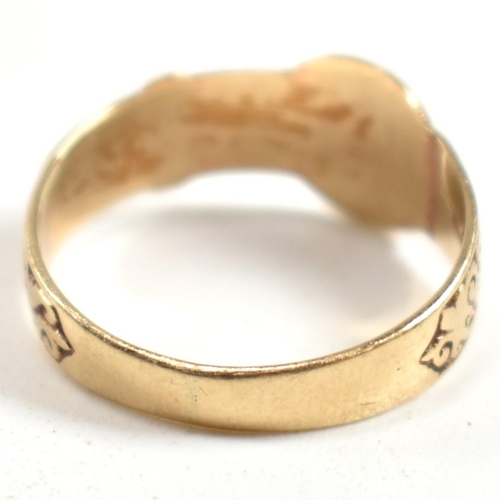 289 - A hallmarked 9ct gold engraved buckle ring. The ring having a belt buckle design with scrolling deco... 