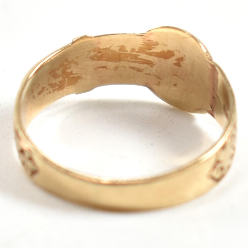 289 - A hallmarked 9ct gold engraved buckle ring. The ring having a belt buckle design with scrolling deco... 