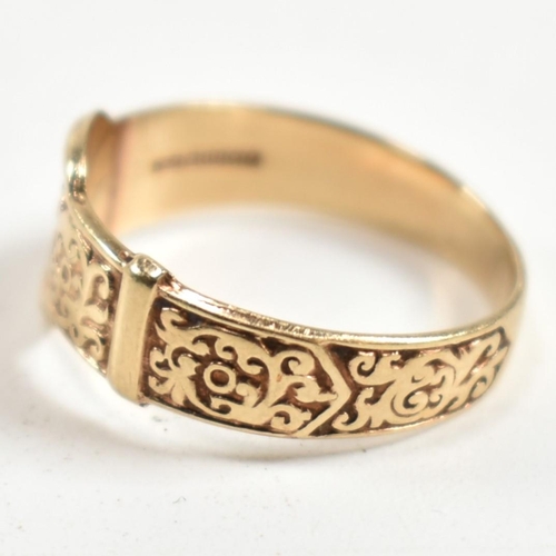 289 - A hallmarked 9ct gold engraved buckle ring. The ring having a belt buckle design with scrolling deco... 