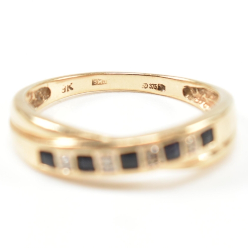 298 - A hallmarked 9ct gold, diamond and sapphire ring. The ring having a single row of five princess cut ... 