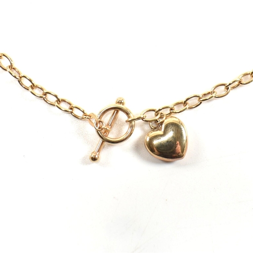 300 - A hallmarked 9ct gold T-bar necklace with heart pendant. The 9ct gold cable chain necklace having a ... 