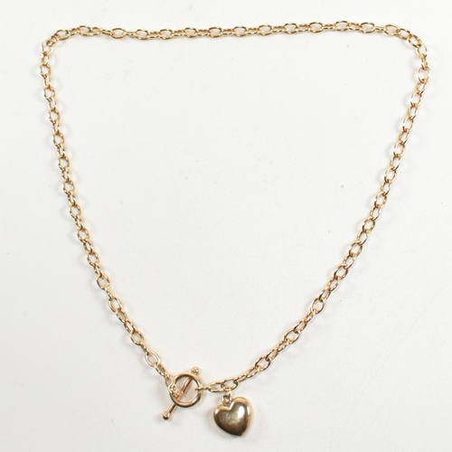 300 - A hallmarked 9ct gold T-bar necklace with heart pendant. The 9ct gold cable chain necklace having a ... 