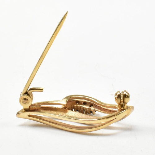 301 - A hallmarked 9ct gold sapphire brooch pin. The brooch in the form of a leaf set with round cut sapph... 