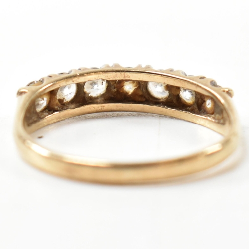 302 - A hallmarked 9ct gold and CZ half hoop ring. The 9ct gold ring having a single row of seven round cu... 