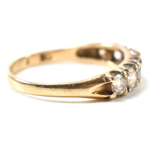 302 - A hallmarked 9ct gold and CZ half hoop ring. The 9ct gold ring having a single row of seven round cu... 