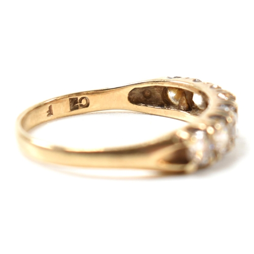 302 - A hallmarked 9ct gold and CZ half hoop ring. The 9ct gold ring having a single row of seven round cu... 