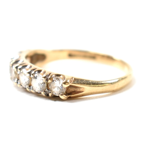 302 - A hallmarked 9ct gold and CZ half hoop ring. The 9ct gold ring having a single row of seven round cu... 