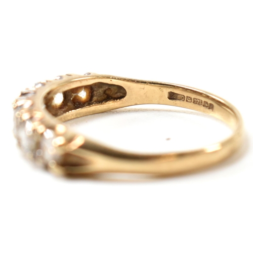 302 - A hallmarked 9ct gold and CZ half hoop ring. The 9ct gold ring having a single row of seven round cu... 