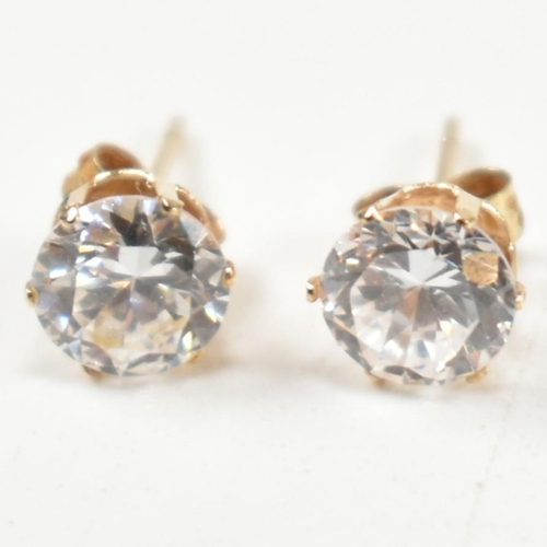 305 - Four pairs of 9ct gold and gem set stud earrings. The earrings to include a pair of 9ct gold faceted... 