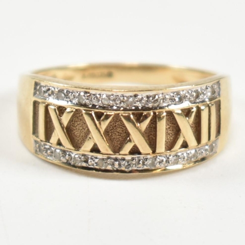 309 - A hallmarked 9ct gold and diamond Roman numeral ring. The 9ct gold ring having a central panel of Ro... 