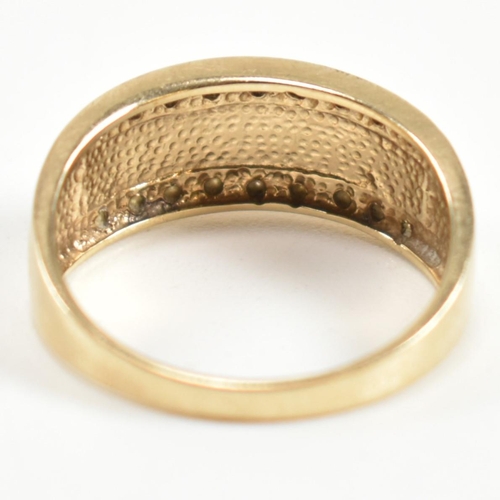 309 - A hallmarked 9ct gold and diamond Roman numeral ring. The 9ct gold ring having a central panel of Ro... 