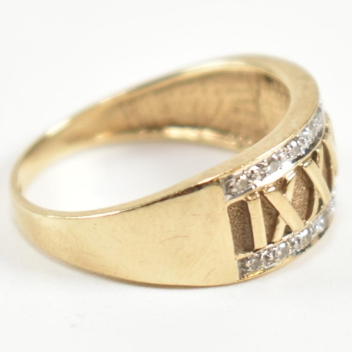 309 - A hallmarked 9ct gold and diamond Roman numeral ring. The 9ct gold ring having a central panel of Ro... 