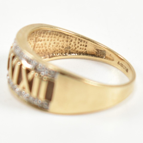 309 - A hallmarked 9ct gold and diamond Roman numeral ring. The 9ct gold ring having a central panel of Ro... 