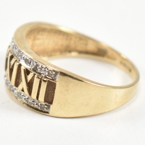 309 - A hallmarked 9ct gold and diamond Roman numeral ring. The 9ct gold ring having a central panel of Ro... 