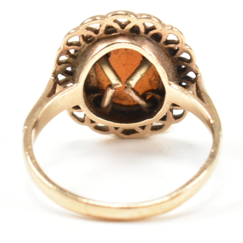 310 - A hallmarked 9ct gold and carved shell cameo ring. The ring having a bezel set carved shell cameo de... 