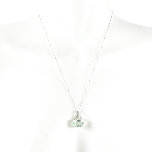 320 - A hallmarked 9ct white gold, diamond and green stone pendant necklace. The pendant set with an oval ... 