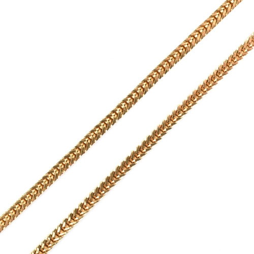 33 - An Italian 18ct gold chain necklace. The necklace formed with a box snake chain link to spring hoop ... 