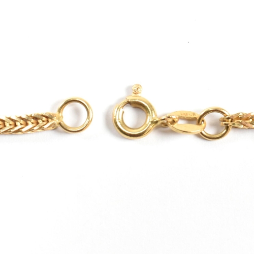 33 - An Italian 18ct gold chain necklace. The necklace formed with a box snake chain link to spring hoop ... 