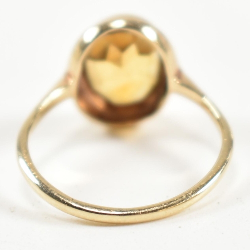 330 - A hallmarked 9ct gold and citrine ring. The ring having a bezel set oval cut citrine in a 9ct gold o... 