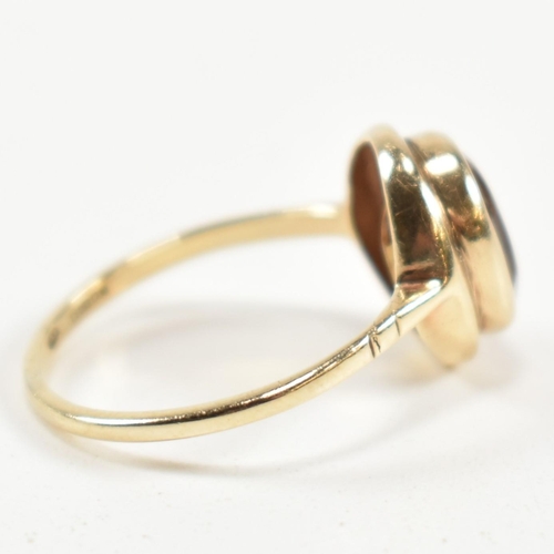 330 - A hallmarked 9ct gold and citrine ring. The ring having a bezel set oval cut citrine in a 9ct gold o... 