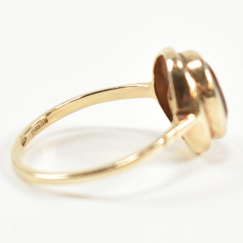 330 - A hallmarked 9ct gold and citrine ring. The ring having a bezel set oval cut citrine in a 9ct gold o... 