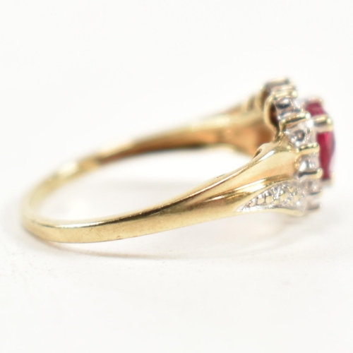 337 - A hallmarked 9ct gold, diamond and synthetic ruby cluster ring. The ring having a central heart cut ... 