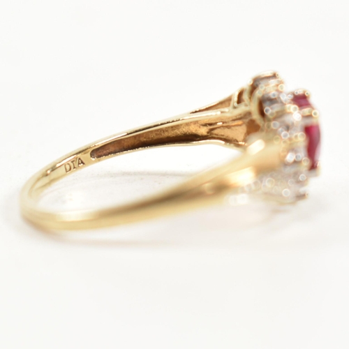 337 - A hallmarked 9ct gold, diamond and synthetic ruby cluster ring. The ring having a central heart cut ... 