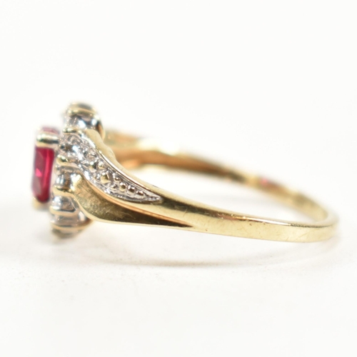 337 - A hallmarked 9ct gold, diamond and synthetic ruby cluster ring. The ring having a central heart cut ... 