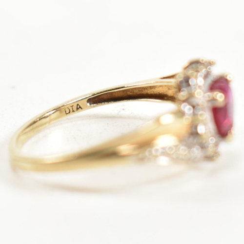 337 - A hallmarked 9ct gold, diamond and synthetic ruby cluster ring. The ring having a central heart cut ... 