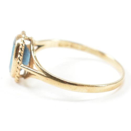 346 - A hallmarked 9ct gold and topaz single stone ring. The ring having a single bezel set oval cut topaz... 