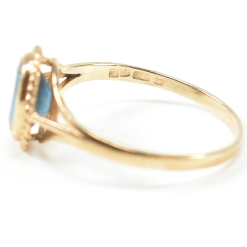 346 - A hallmarked 9ct gold and topaz single stone ring. The ring having a single bezel set oval cut topaz... 