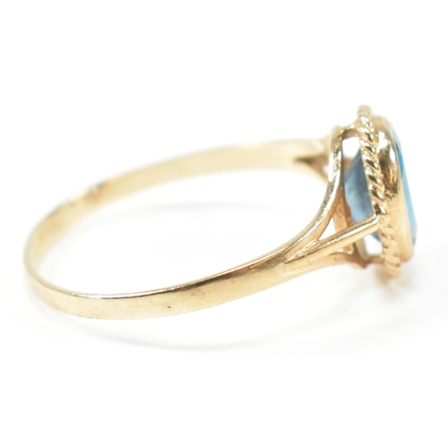 346 - A hallmarked 9ct gold and topaz single stone ring. The ring having a single bezel set oval cut topaz... 