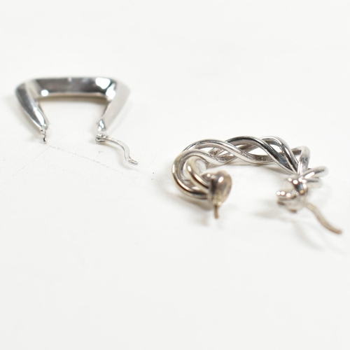 348 - Two pairs of 9ct white gold hoop earrings. The earrings to include a pair of hallmarked 9ct white go... 