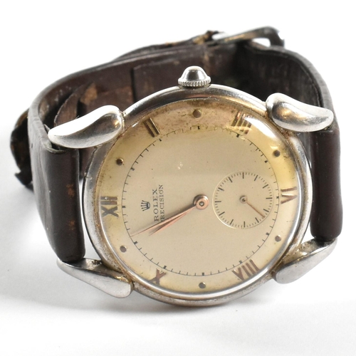 35 - A 1950s Rolex Precision gentleman's stainless steel wristwatch. The two piece case with swept down a... 