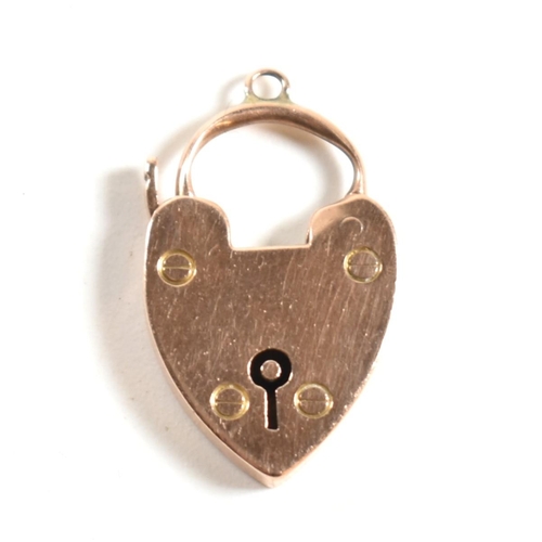 350 - A 9ct rose gold heart padlock clasp. The 9ct rose gold clasp having a padlock design to clasp with b... 