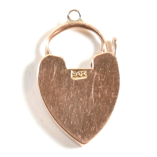 350 - A 9ct rose gold heart padlock clasp. The 9ct rose gold clasp having a padlock design to clasp with b... 