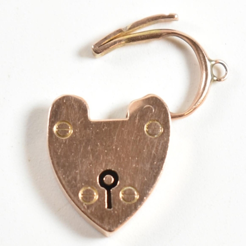 350 - A 9ct rose gold heart padlock clasp. The 9ct rose gold clasp having a padlock design to clasp with b... 