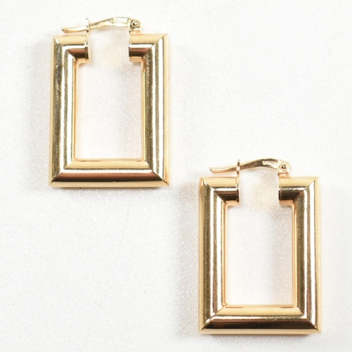 352 - A pair of hallmarked 9ct gold rectangular hoop earrings. The rectangular hoop earrings having a smoo... 