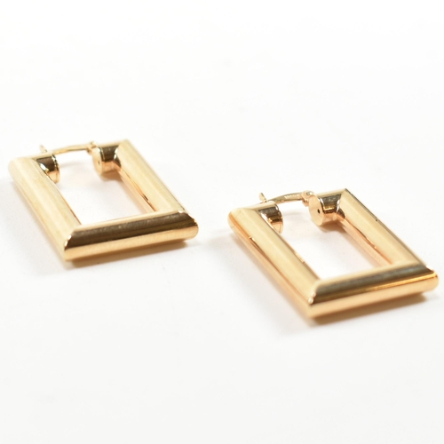 352 - A pair of hallmarked 9ct gold rectangular hoop earrings. The rectangular hoop earrings having a smoo... 