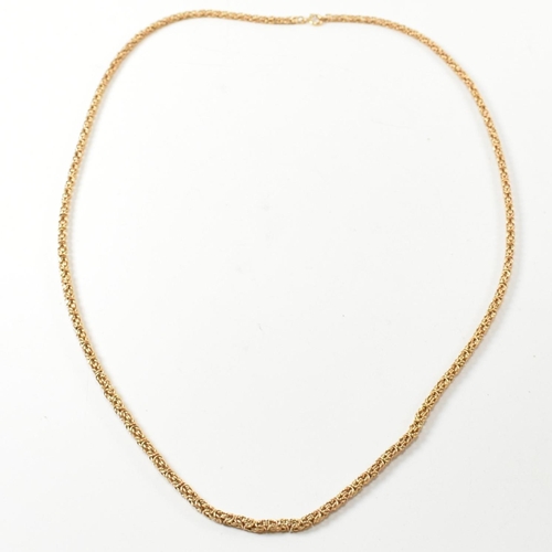 36 - A Portuguese 19.2ct gold byzantine chain necklace. The 19.2ct gold byzantine chain necklace having a... 