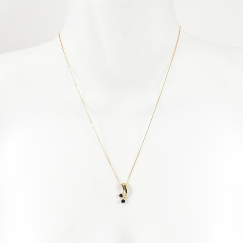 361 - A hallmarked 9ct gold and sapphire pendant necklace. The 9ct gold fine curb link chain necklace stru... 