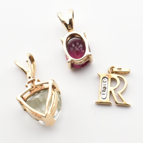 365 - Three 9ct gold and gem set necklace pendants. The pendants to include a hallmarked 9ct gold and fanc... 