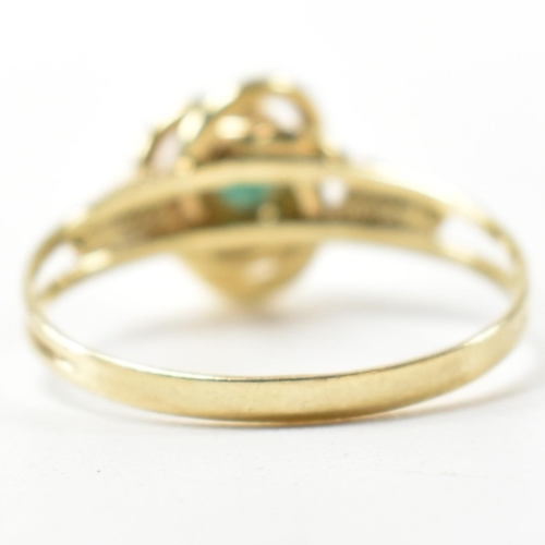 378 - A 14ct gold and blue stone ring. The 14ct gold ring having a central twist design set with a round b... 