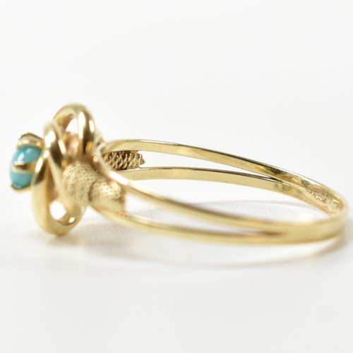 378 - A 14ct gold and blue stone ring. The 14ct gold ring having a central twist design set with a round b... 