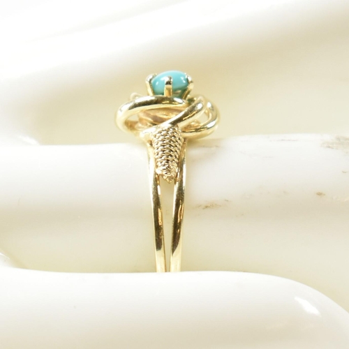 378 - A 14ct gold and blue stone ring. The 14ct gold ring having a central twist design set with a round b... 