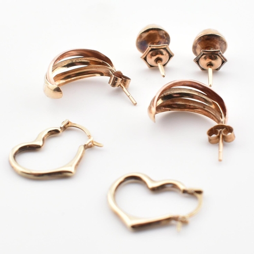 381 - Three pairs of 9ct gold earrings. The earrings to include a pair of hallmarked 9ct gold faceted half... 