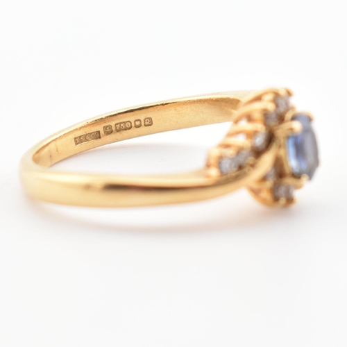 39 - A hallmarked 18ct gold, Ceylon sapphire and diamond ring. The ring having a central oval cut Ceylon ... 