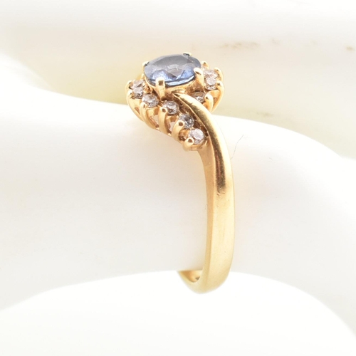 39 - A hallmarked 18ct gold, Ceylon sapphire and diamond ring. The ring having a central oval cut Ceylon ... 