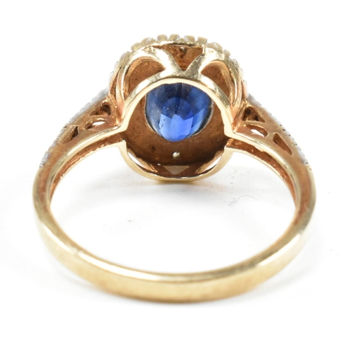 393 - A hallmarked 9ct gold, sapphire and diamond ring. The ring having an oval cut sapphire set in a whit... 