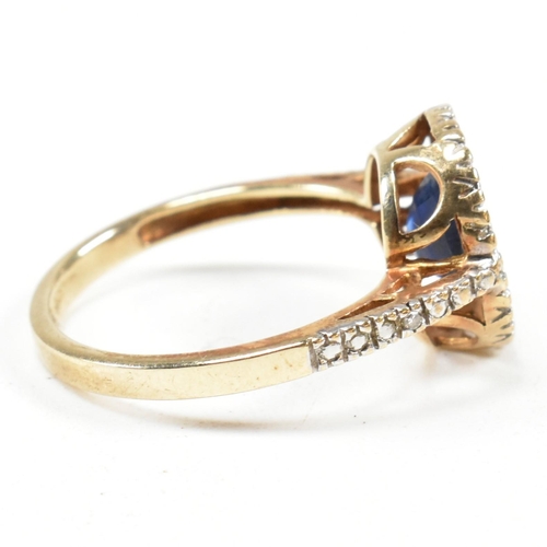 393 - A hallmarked 9ct gold, sapphire and diamond ring. The ring having an oval cut sapphire set in a whit... 